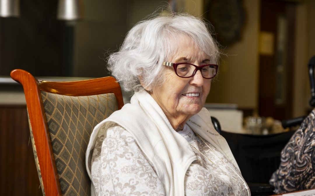 Reflective portrait of a Willow Brook Home resident in Columbus, Ohio, capturing a quiet moment in the daily senior living experience.